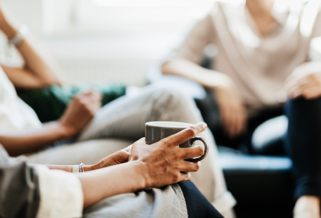 A group of people meet with a financial planner.