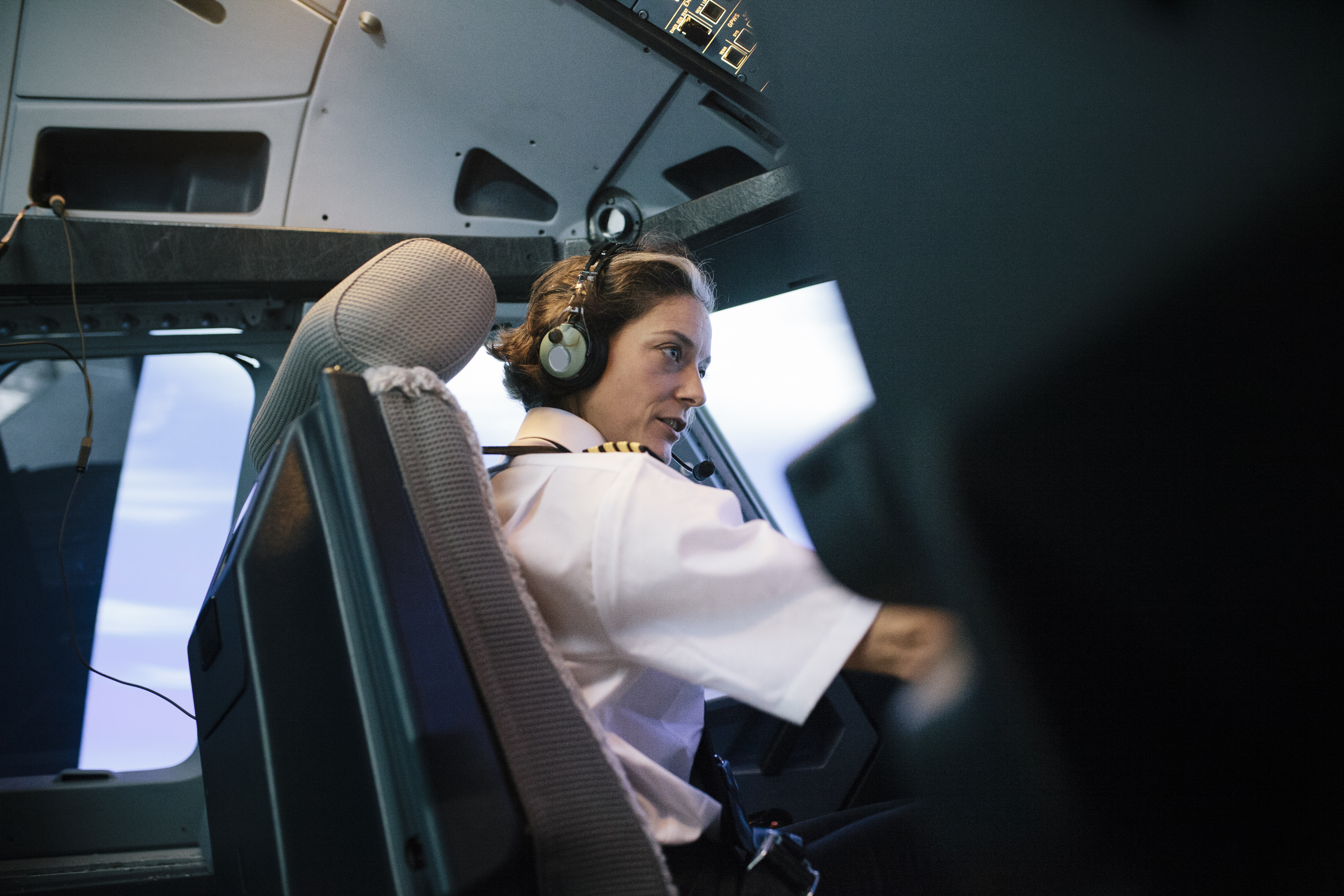 A pilot flies a plane. 